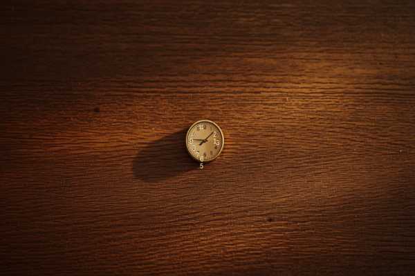 Clock on a wooden desk