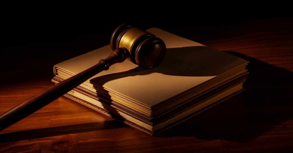 Gavel resting on stacked legal documents representing Modoc County probate court