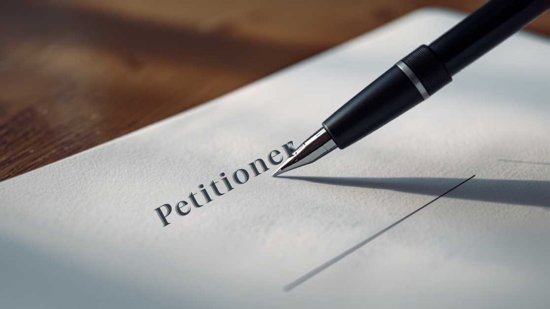 Pen resting on a legal petition document